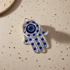 A fashionable and individual necklace with a silver hand-shaped pendant set with blue gemstones and blue eye ornaments Application Scenario